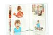 Open baby photo album isolated on white