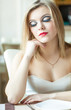 A woman is sitting in the restaurant
