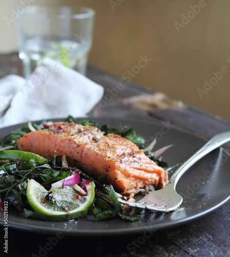 Photo: Portion of roasted salmon steak with fresh spring salad Portion of roasted salmon steak with fresh spring salad