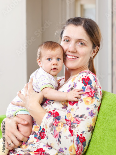 Photo: Portrait of happy mother with baby Portrait of happy mother with baby