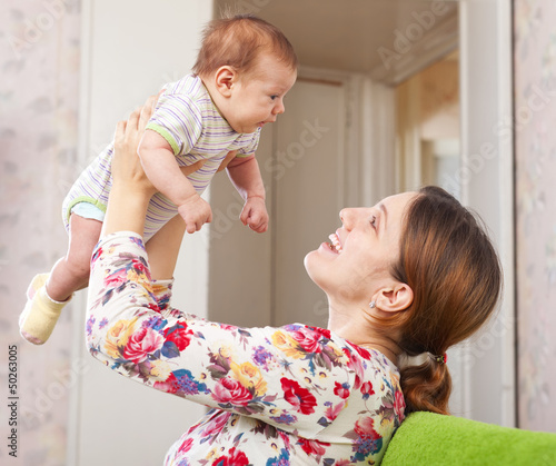 Photo: Happy mother holds to baby Happy mother holds to baby