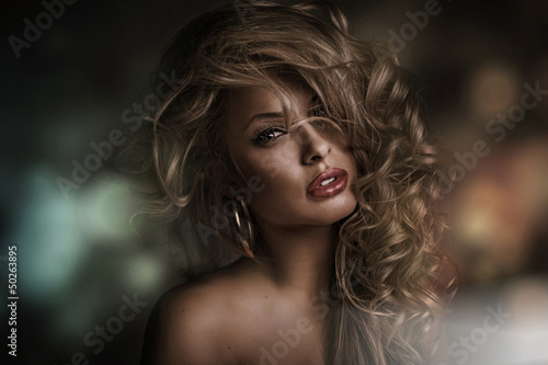 Photo: Perfect woman face with dark background Perfect woman face with dark background
