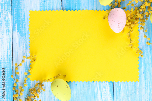 Photo: Empty card with easter eggs and mimosa flowers, Empty card with easter eggs and mimosa flowers,