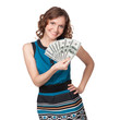 Portrait of pretty young woman holding a fan of dollar bills