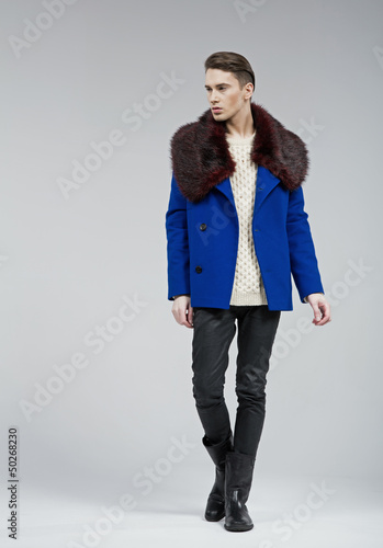 Photo: Handsome young man dressed in blue coat Handsome young man dressed in blue coat