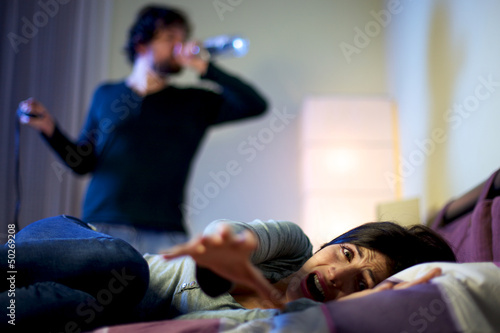 Photo: Beautiful woman depressed screaming about drunk husband drinking Beautiful woman depressed screaming about drunk husband drinking