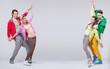 Two hip-hop couples dance and smile