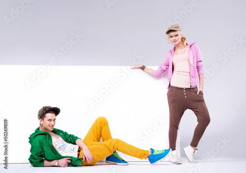 Photo: Cheerful teenagers in loose clothes Cheerful teenagers in loose clothes
