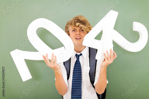 Photo: high school boy struggling with mathematics high school boy struggling with mathematics
