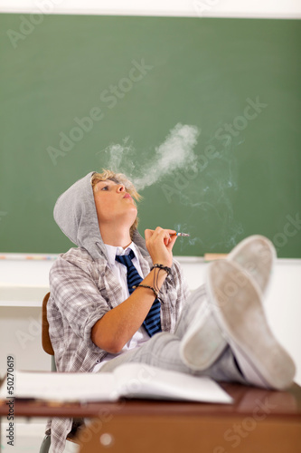 Photo: troublesome teen boy smoking troublesome teen boy smoking