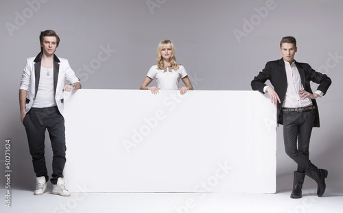 Photo: Two handsome men and their attractive female friend Two handsome men and their attractive female friend