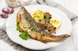 Roasted fish with lemon, mushrooms and herbs