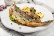 Roasted fish with lemon, mushrooms and herbs