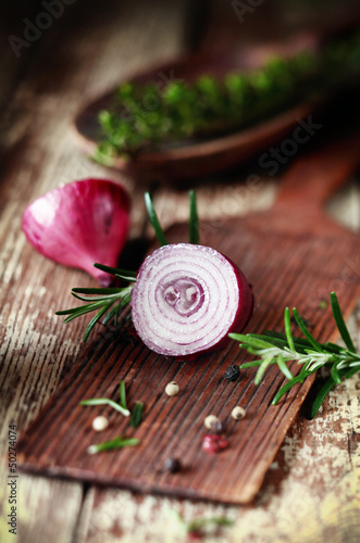 Photo: Sliced half red onion and herbs Sliced half red onion and herbs