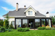 A new house with a garden in a rural area under beautiful sky