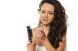 Photo: girl is very nervous about the loss of hair on white background girl is very nervous about the loss of hair on white background