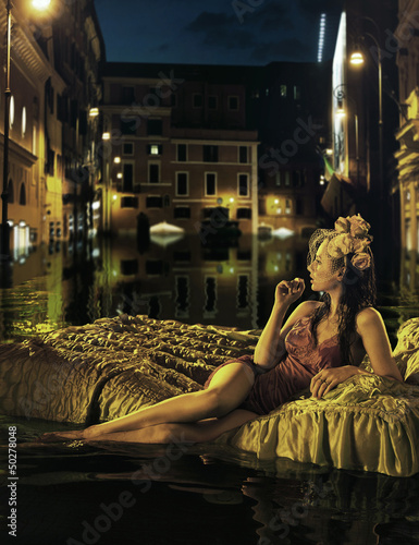 Photo: Alone lady watching flooded city Alone lady watching flooded city