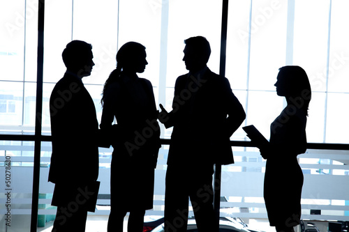Photo: silhouettes of businesspeople silhouettes of businesspeople