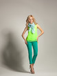 Smiling woman with curly hair presenting spring collection