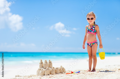Photo: Little girl at tropical beach Little girl at tropical beach