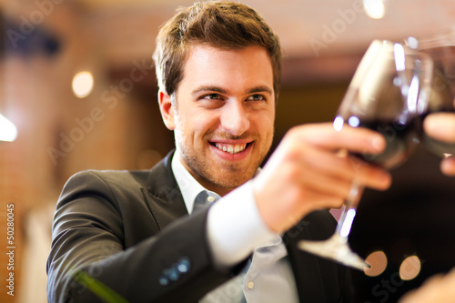 Photo: Couple toasting wine Couple toasting wine
