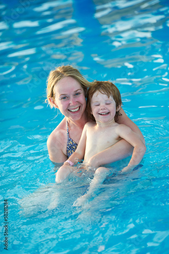 Photo: Woman and child in resort swimming pool Woman and child in resort swimming pool