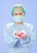 Doctor (woman) holding many medical ampoules in her hands
