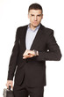 businessman looking at his watch with a laptop bag
