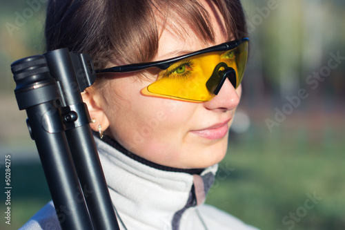 Photo: Young beautiful girl with a shotgun Young beautiful girl with a shotgun