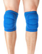 Knee pads to protect the games on male legs. On a white backgrou