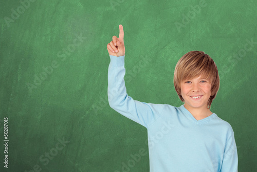 Photo: Happy student asking to speak in the class Happy student asking to speak in the class