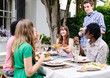 Friends enjoying food and drinks at a gathering