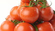 ripe tomatoes with drops of water