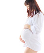 Image of pregnant woman touching her belly with hands