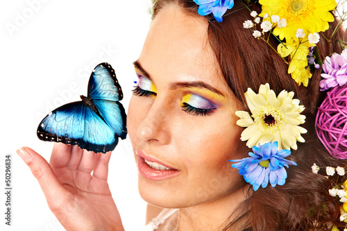 Photo: Woman with flower and butterfly. Woman with flower and butterfly.