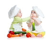children boy and girl wearing a chef hat with healthy  food vege