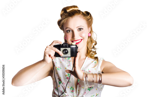 Photo: Smiling pinup woman with retro camera Smiling pinup woman with retro camera