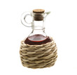Small decanter with red wine vinegar isolated on the white