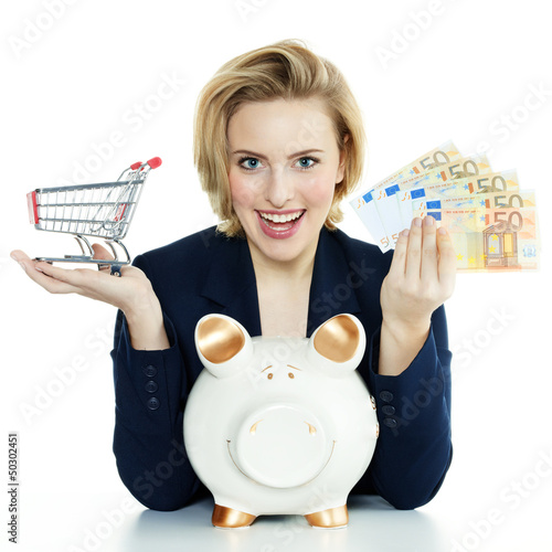 Photo: Woman is happy to save money with piggy bank for shopping Woman is happy to save money with piggy bank for shopping