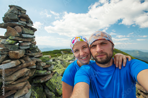 Photo: Portrait of couple at the top of the mountain Portrait of couple at the top of the mountain