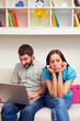 bored woman sitting while her boyfriend