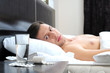 Man sleeping - pills on bed table