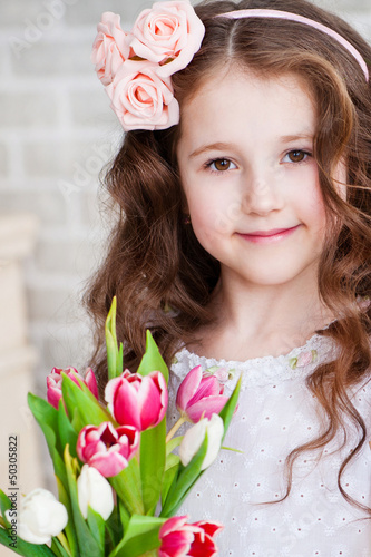 Photo: Portrait of a beautiful girl with tulips Portrait of a beautiful girl with tulips