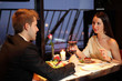 Brunette and young guy met at a restaurant for dinner
