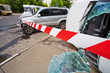 Photo: Place of car accident fenced with barrier tape Place of car accident fenced with barrier tape