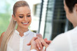 Cute girl being surprised with diamond ring.
