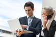 Photo: Young business couple on outdoor meeting. Young business couple on outdoor meeting.