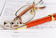 Contract with glasses, pen and dices cubes with words YES NO. Se