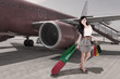 Affluent travel - beautiful woman arriving at airport