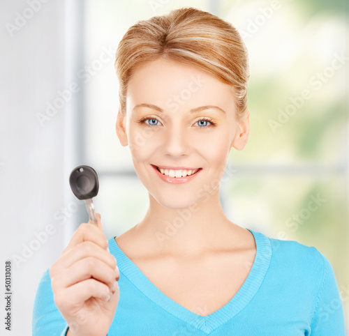 Photo: happy woman with car key happy woman with car key